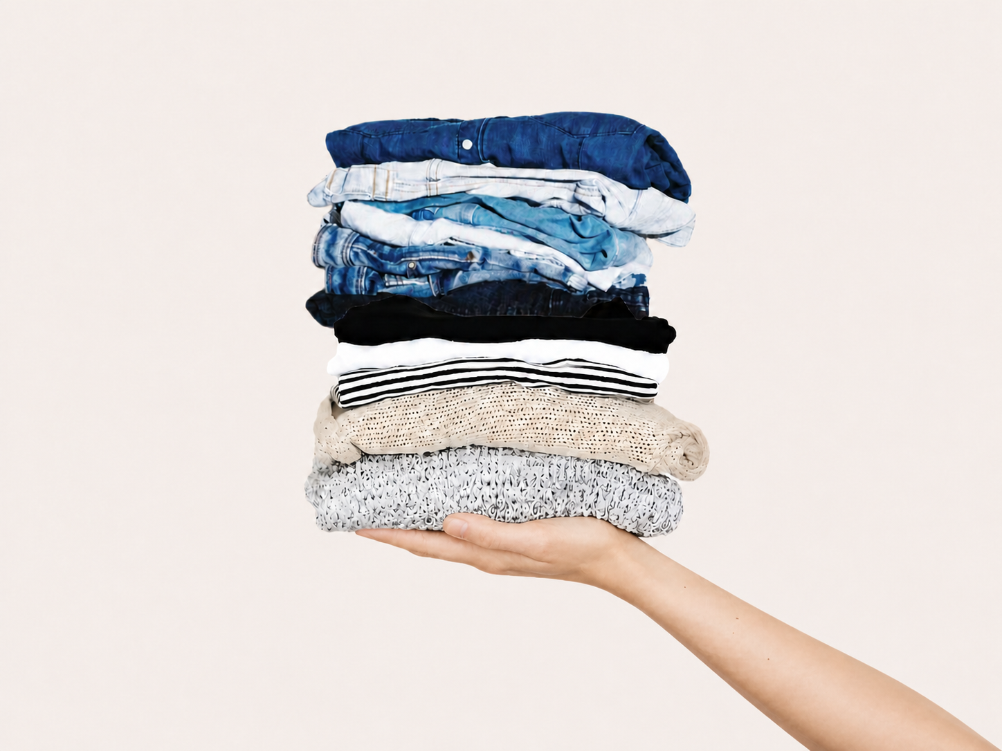 Folded knit, denim, and woven garments held out for inspection — Jiangsu Ventures Ltd. sourced fabrics